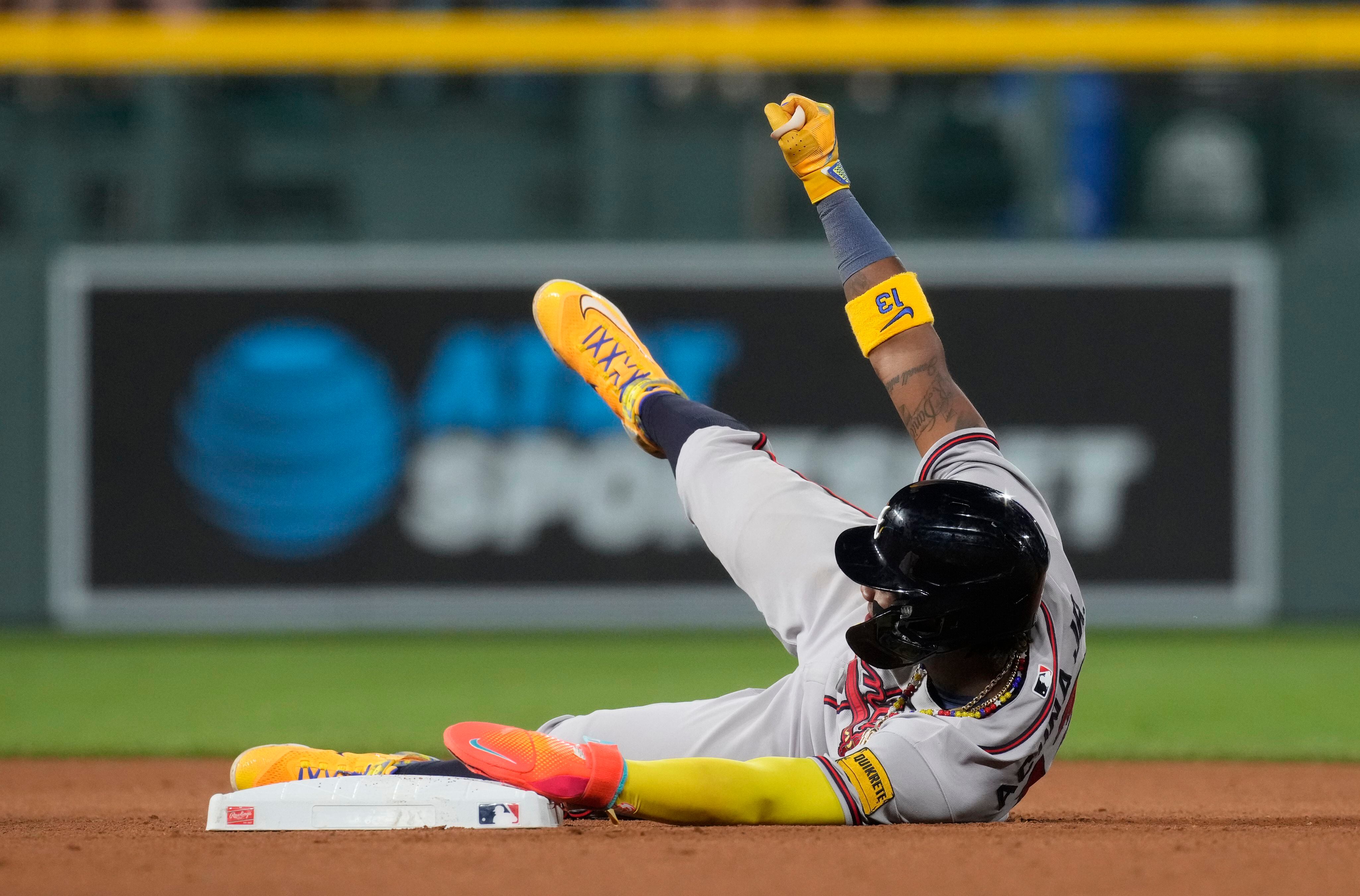 Ronald Acuña Jr. knocked over by fan charging field in Colorado, but Braves  star says he's OK – KXAN Austin