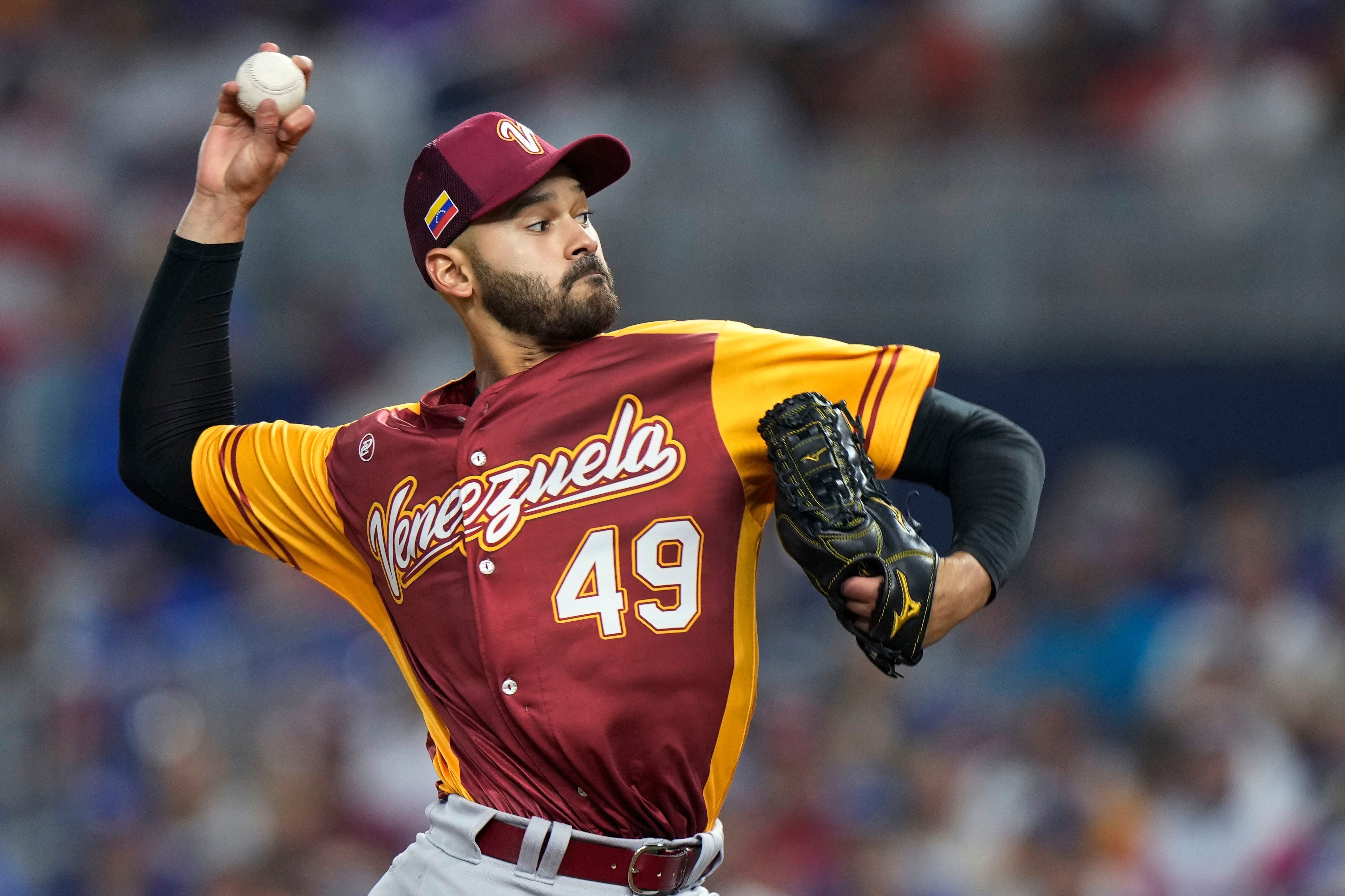 United States pitcher Brady Singer throws against Mexico during