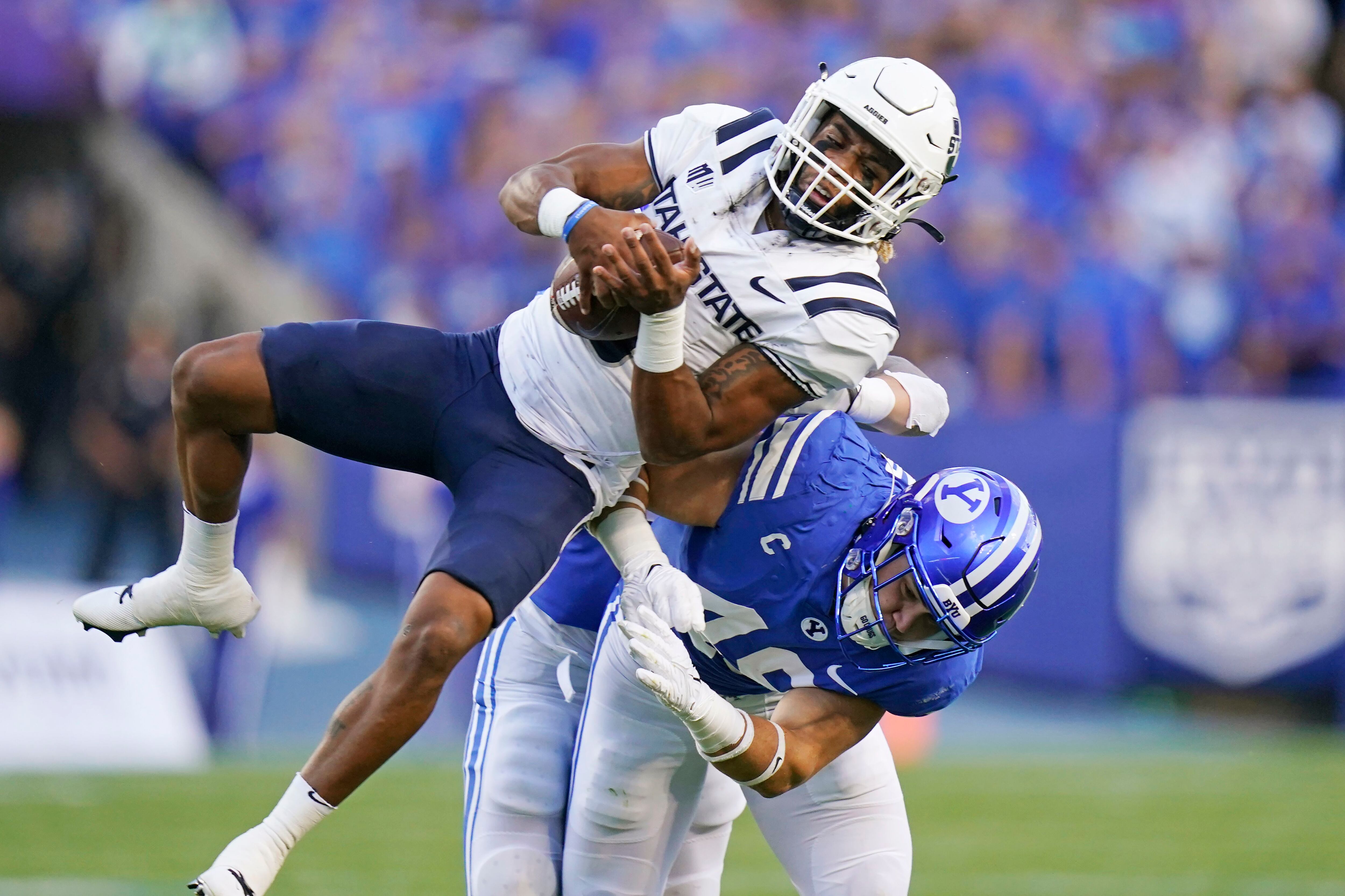 Hall tosses 3 TDs, rallies No. 19 BYU past Utah State 38-26