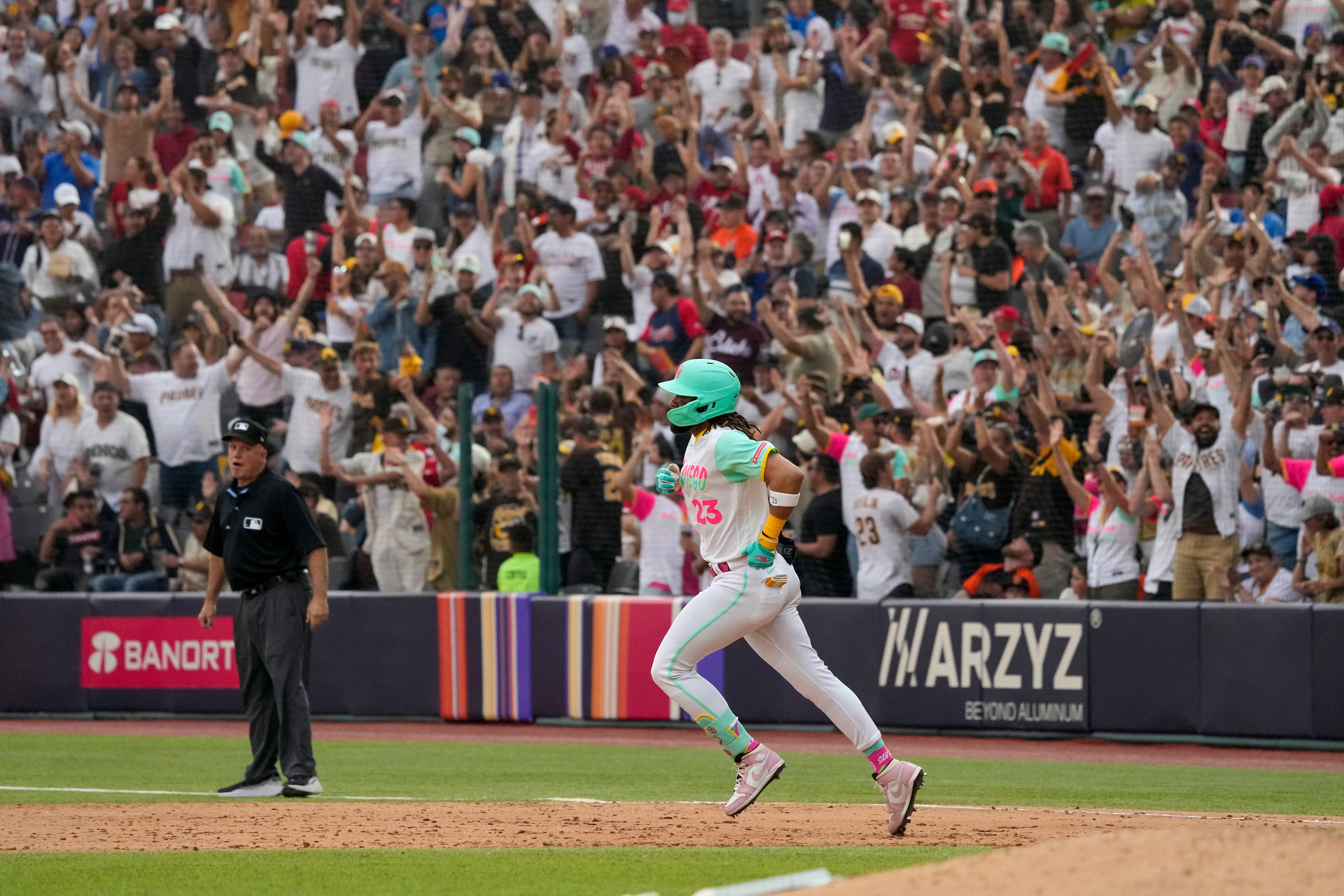 Juan Soto of the San Diego Padres celebrates by wearing a sombrero