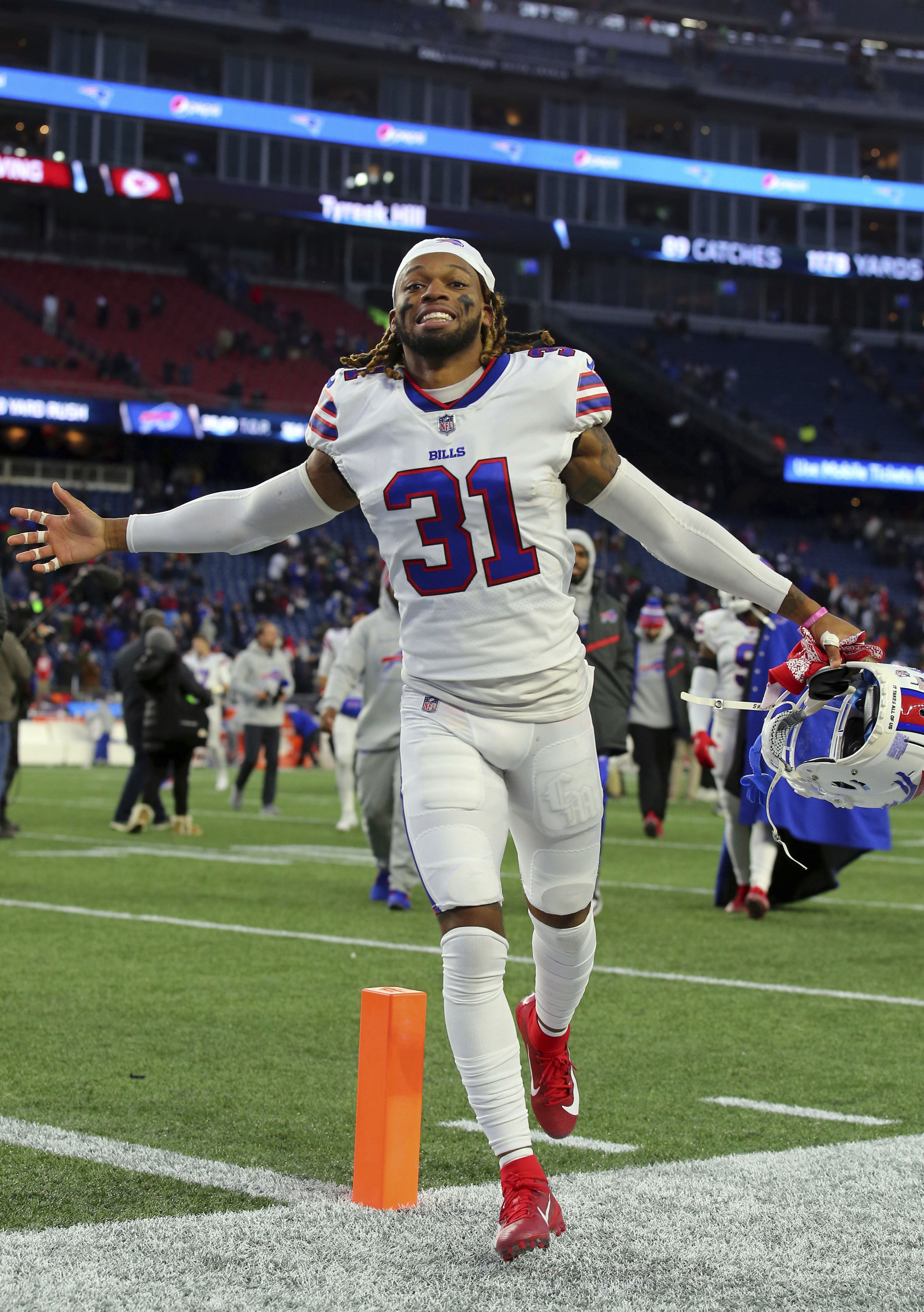 Buffalo Bills quarterback Josh Allen, center, walks the field during  practice while players wear the number 3 in support of safety Damar Hamlin  during practice before an NFL football game against the