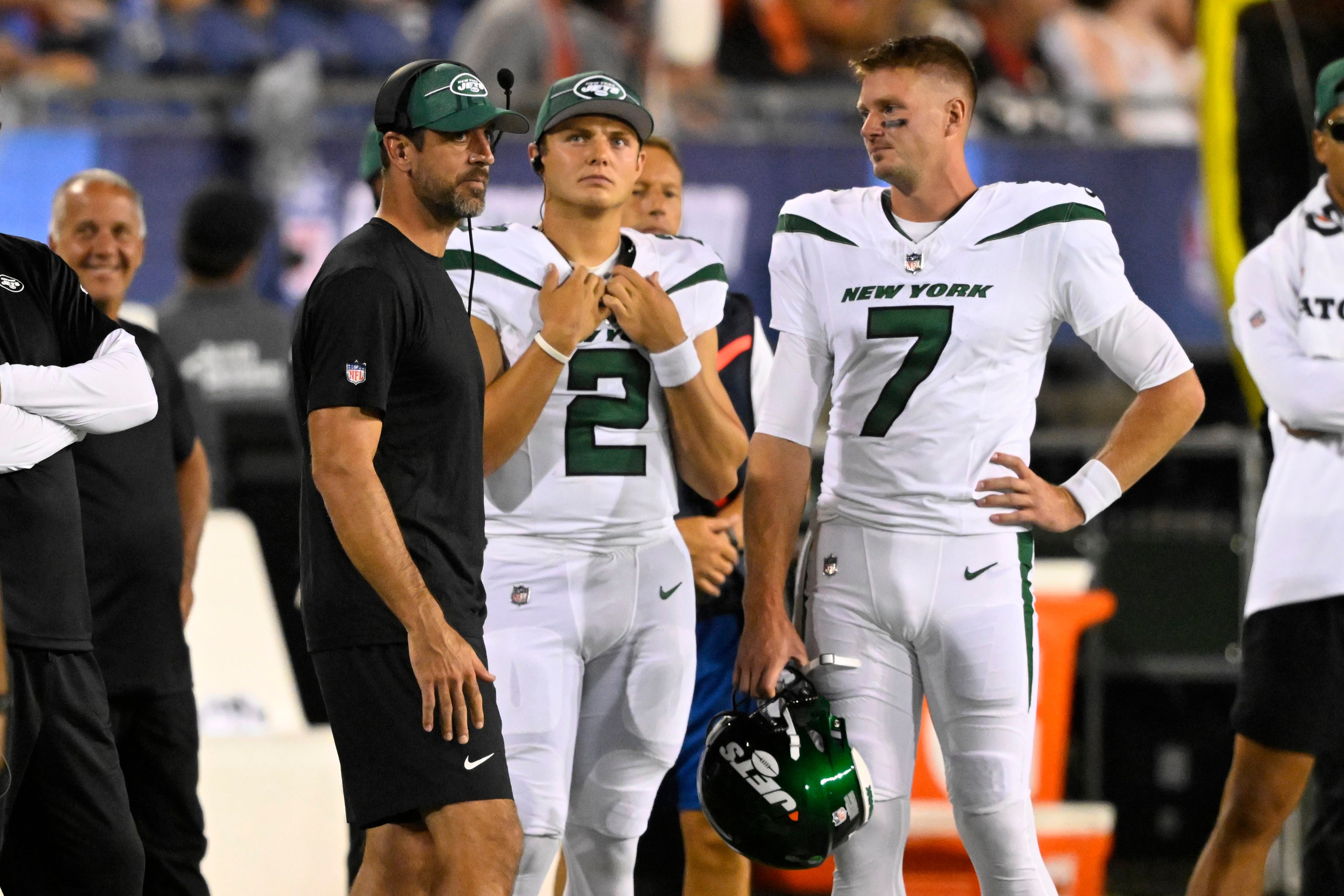 New York Jets quarterback Aaron Rodgers (8) stands on the sidelines during  the first half of an NFL preseason football game against the New York Giants,  Saturday, Aug. 26, 2023, in East