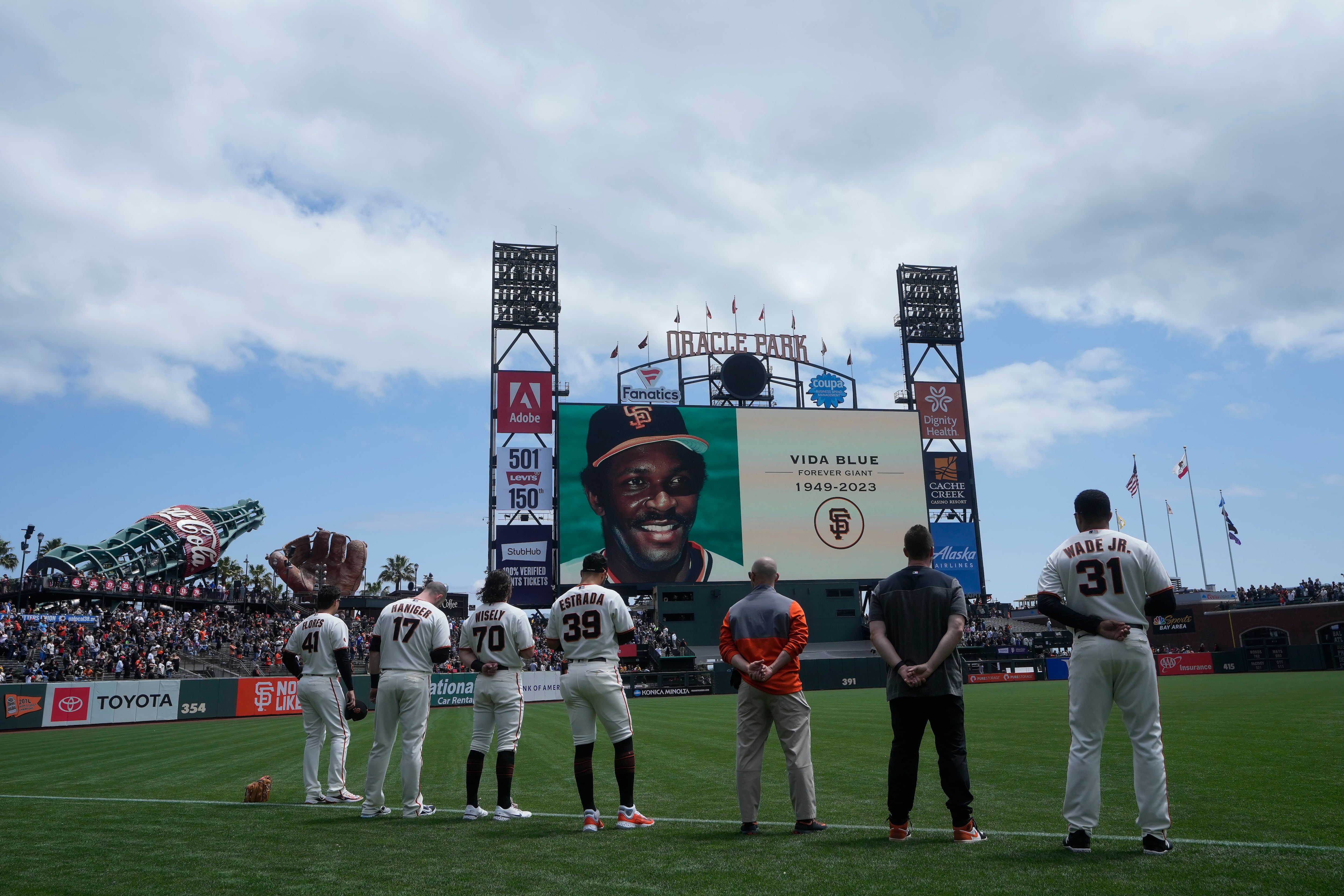 Former Oakland Athletics player Reggie Jackson throws out the ceremonial  first pitch after a ceremony honoring the Athletics' 1973 World Series  championship team before a baseball game between the Athletics and the