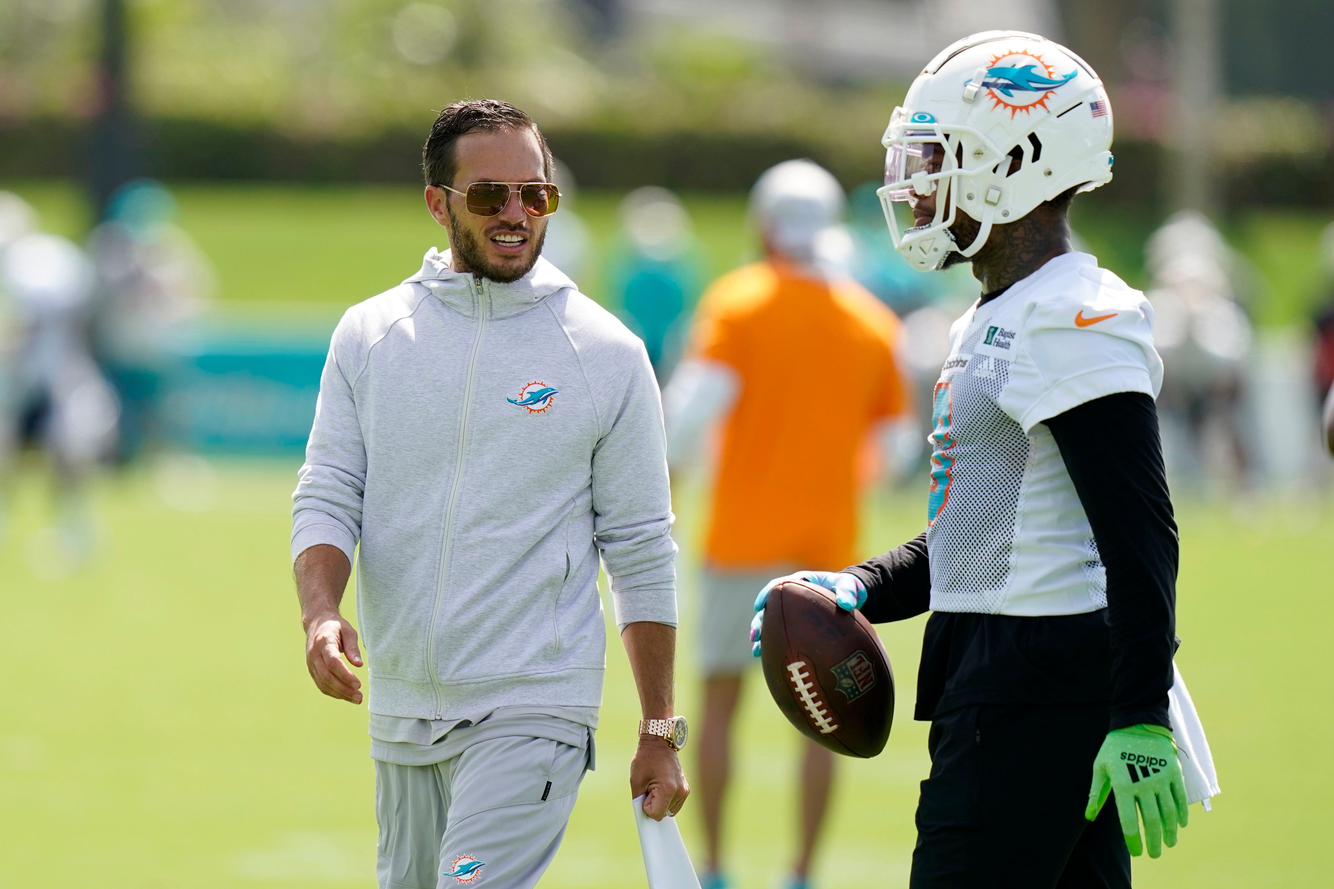 Miami Dolphins players celebrate after wide receiver Lynn Bowden