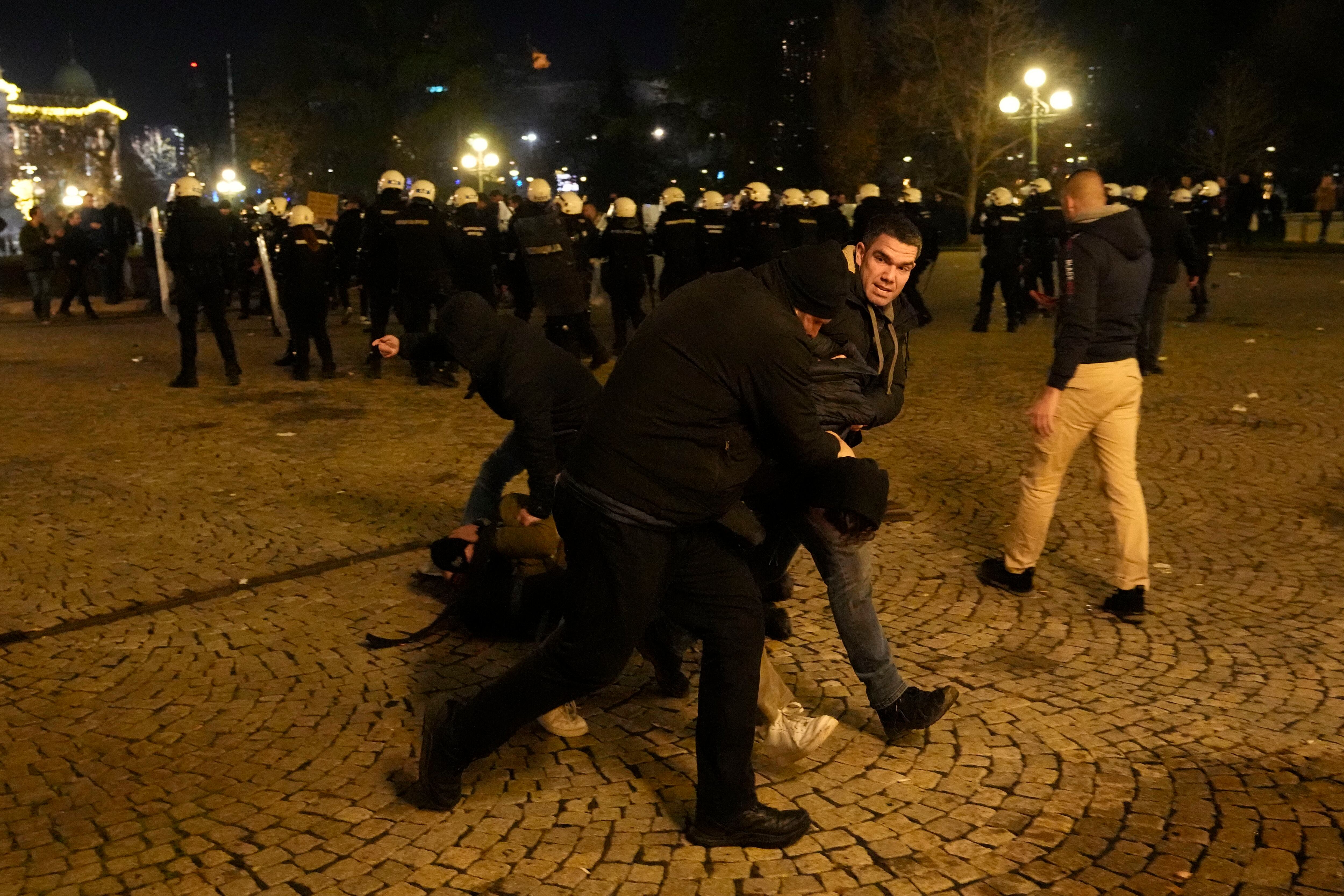 Serbian police fire tear gas at protesters threatening to storm city hall