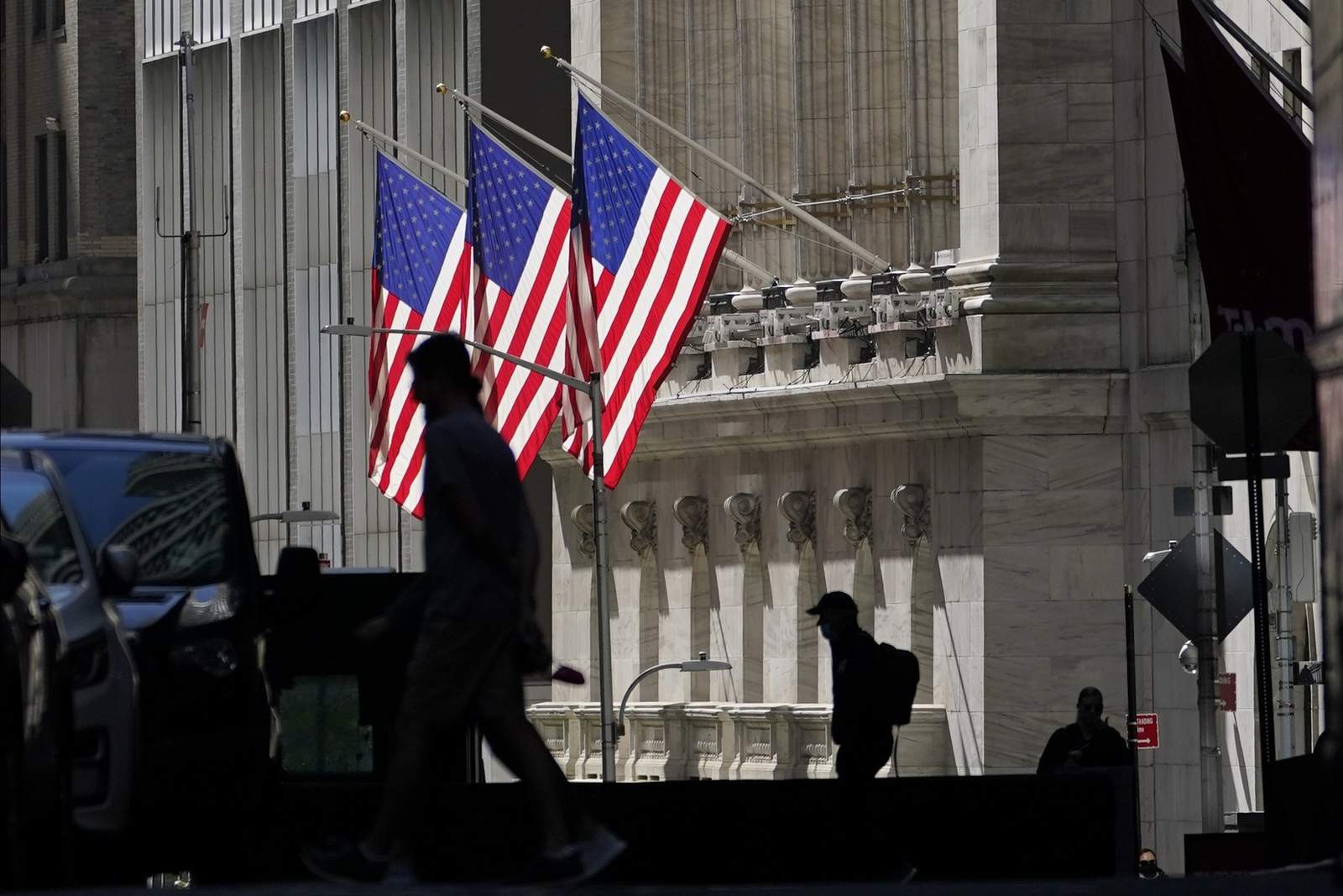 Wall Street closes higher after Fed says will keep rates low