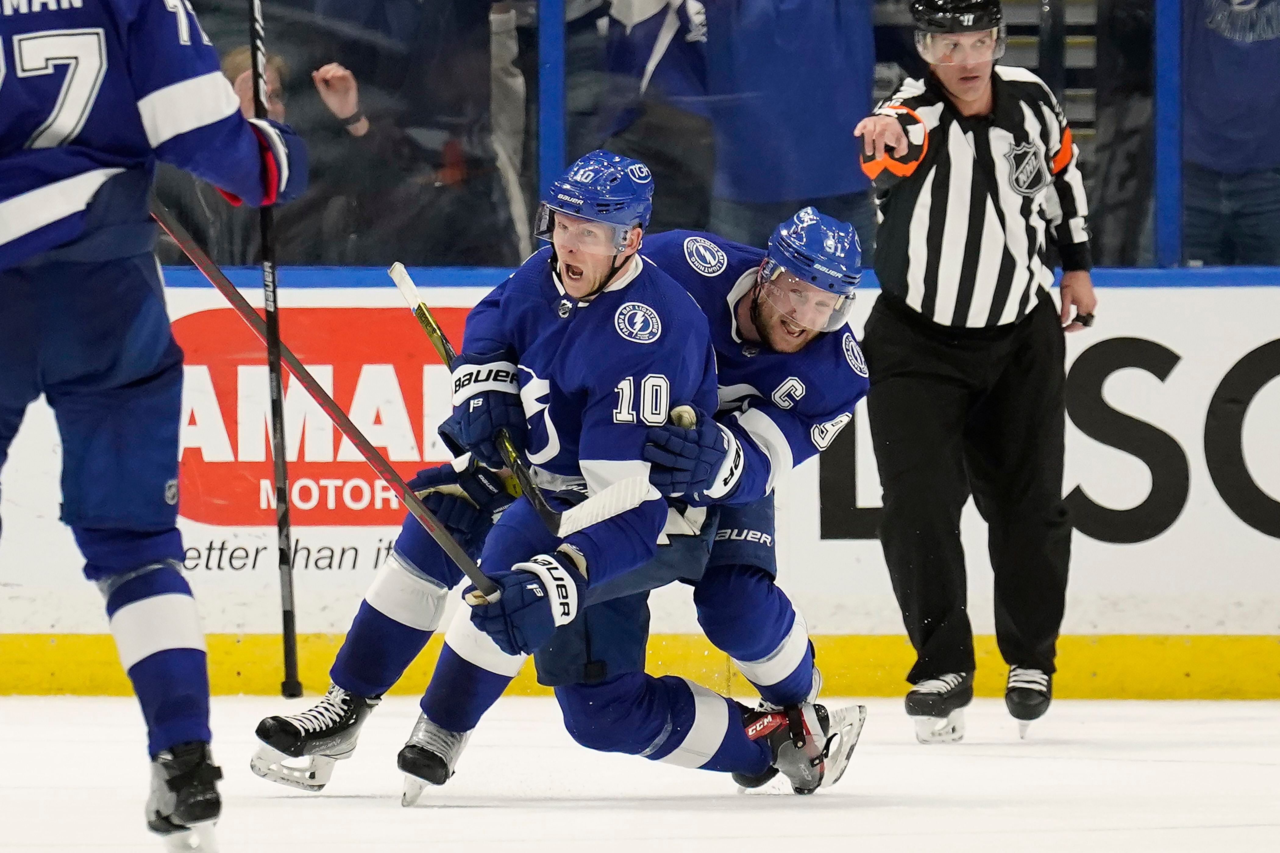 Tampa Bay Lightning center Brayden Point (21) celebrates his goal with  Ondrej Palat, right, as …