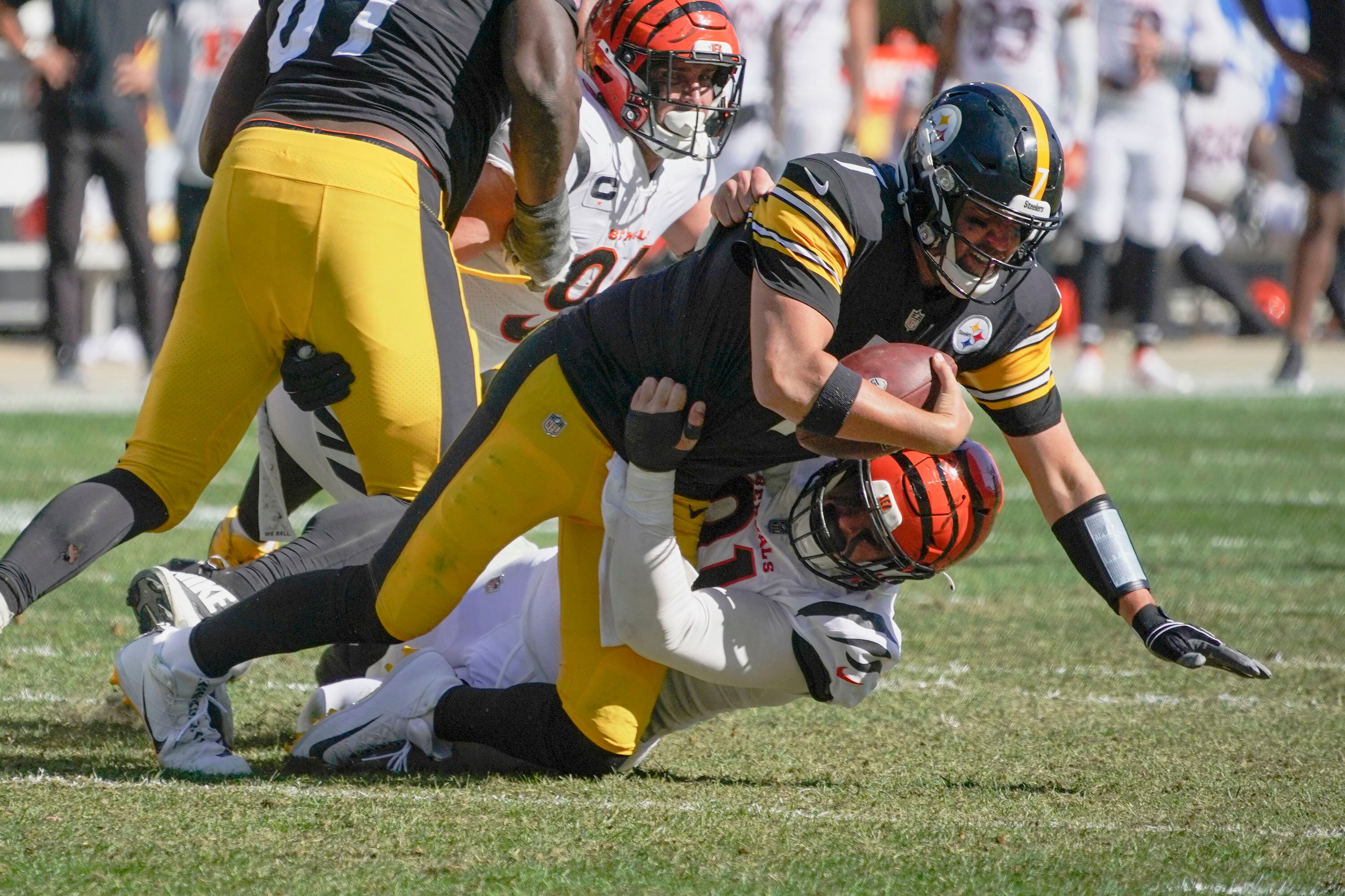 Cincinnati Bengals Michael Johnson holds on the jersey and sacks Pittsburgh  Steelers quarterback Ben Roethlisberger for a lost of eight yards in the  second quarter at Heinz Field in Pittsburgh, Pennsylvania on