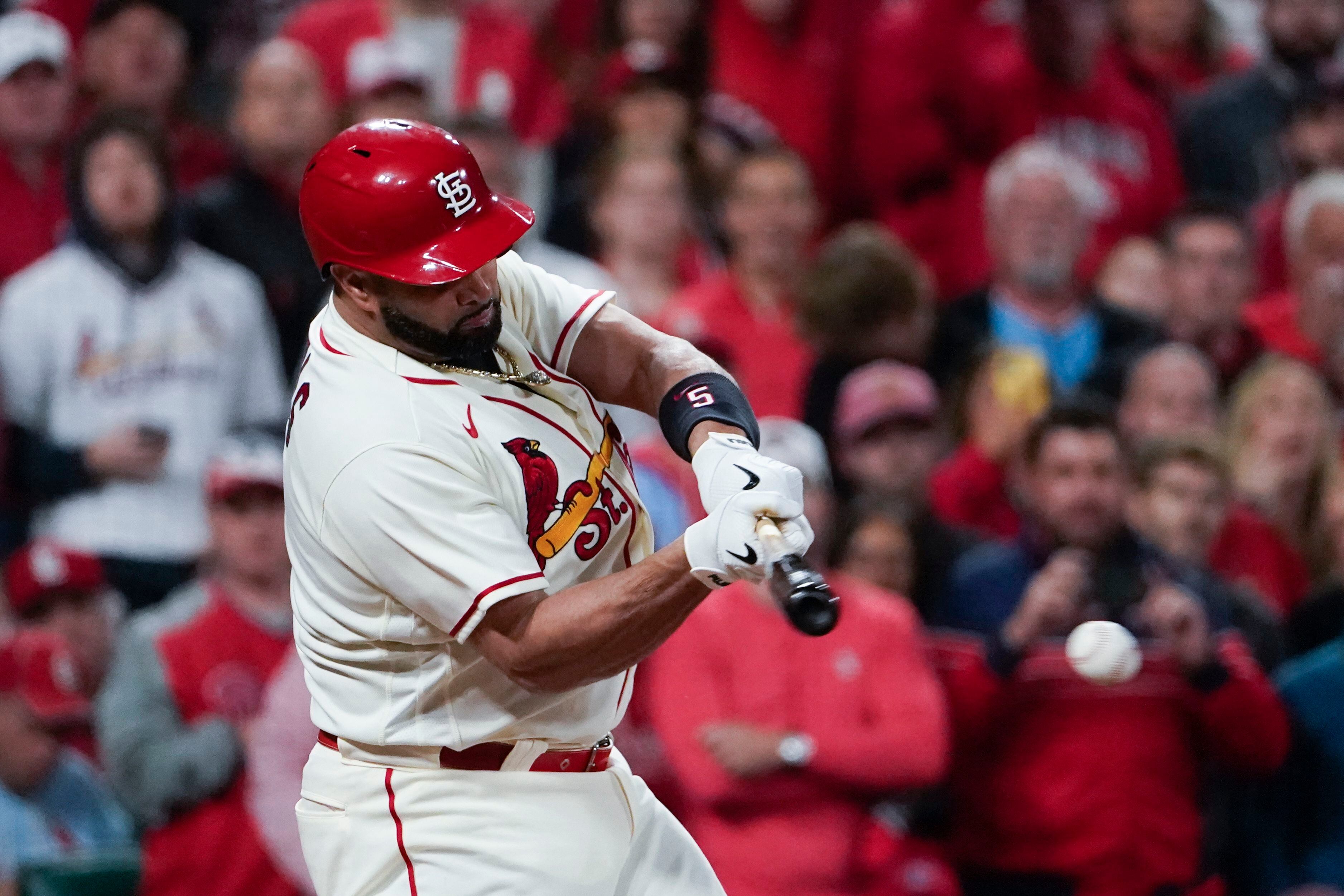 St. Louis Cardinals starter Miles Mikolas wipes his head and face